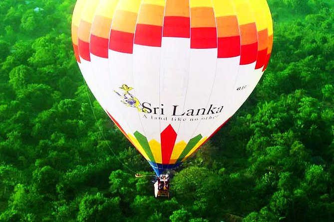 Hot Air Balloon Ride: 7 Magical Secrets to See Dambulla from Above 2 A vibrant hot air balloon inflating at dawn, ready for a Sri Lanka Hot Air Balloon Ride over Dambulla's scenic landscape.